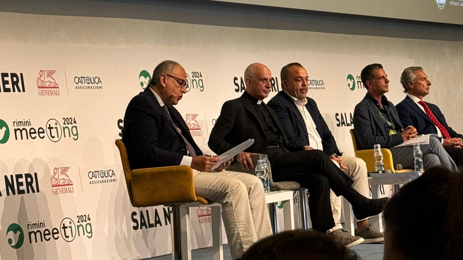 caption: Archbishop Fisichella speaks at the Rimini Meeting 2024